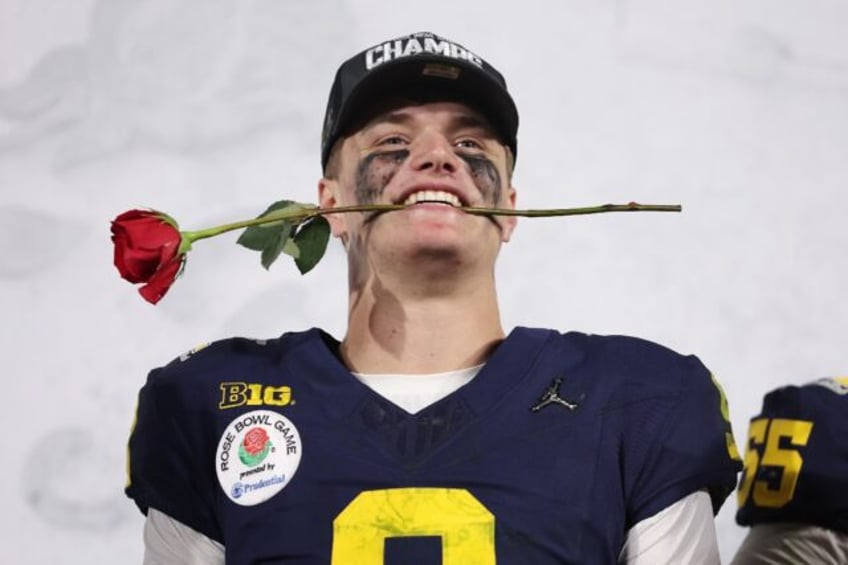 University of Michigan quarterback J.J. McCarthy celebrates after the undefeated Wolverines beat Alabama in the Rose Bowl to earn a berth in next week's US College Football Playoff championship game