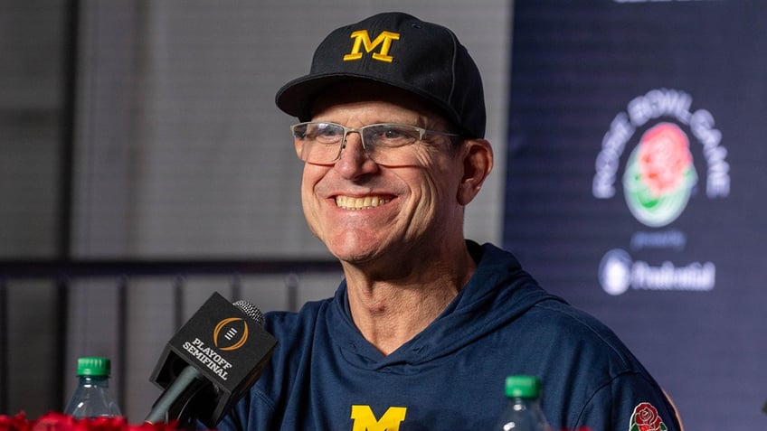 Jim Harbaugh smiles