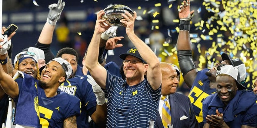 michigan coach jim harbaughs suspension falls through hes likely to coach all season report