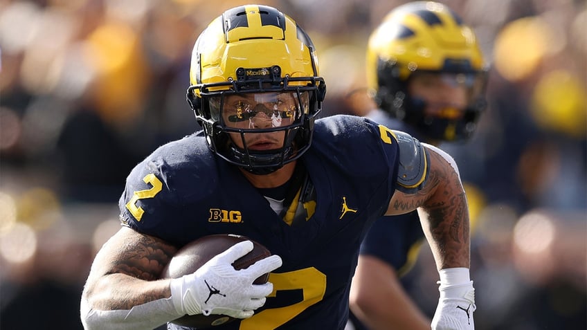 michigan defeats ohio state for third straight year after last minute interception