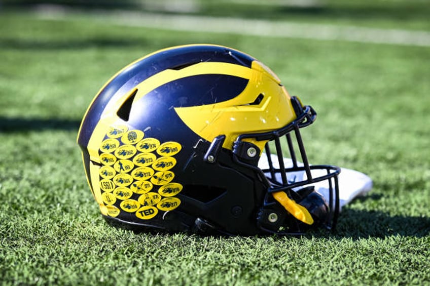 michigan football staffer fired after allegedly trying to meet 13 year old girl