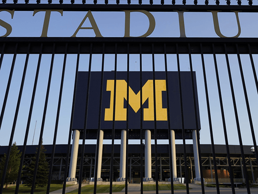 michigan football staffer fired after allegedly trying to meet 13 year old girl