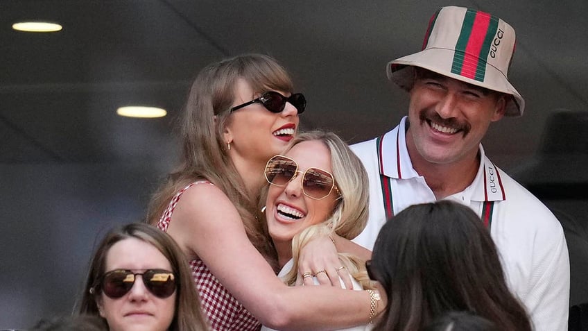 Taylor Swift and Brittany Mahomes embrace