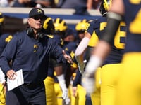 Michigan overcomes slow start to defeat Rutgers in Jim Harbaugh's return from 3-game suspension