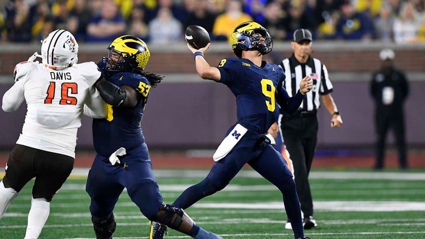 michigan overcomes slow start to defeat rutgers in jim harbaughs return from 3 game suspension