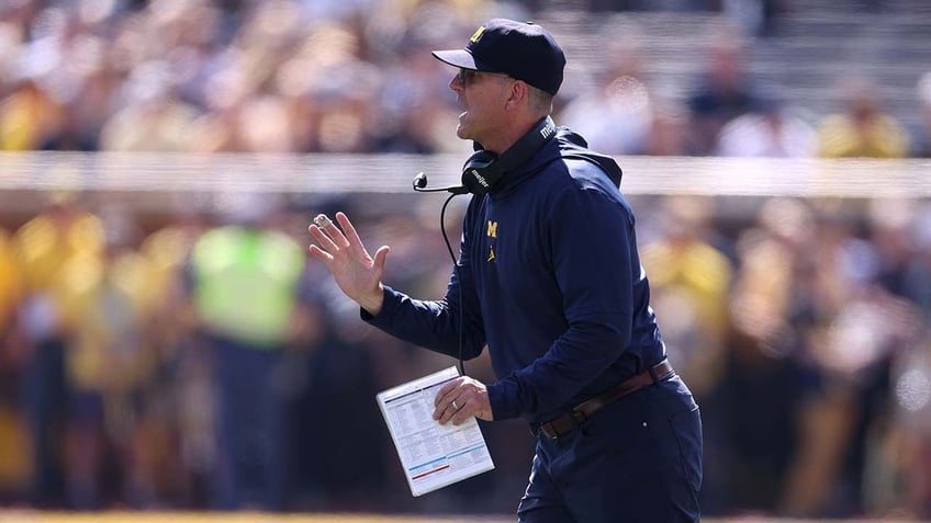 michigan overcomes slow start to defeat rutgers in jim harbaughs return from 3 game suspension