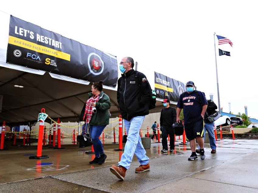 WARREN, MICHIGAN - MAY 18: United Auto Workers members leave the Fiat Chrysler Automobiles