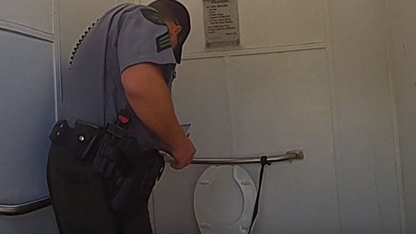 michigan woman rescued from inside outhouse toilet in pursuit of apple watch