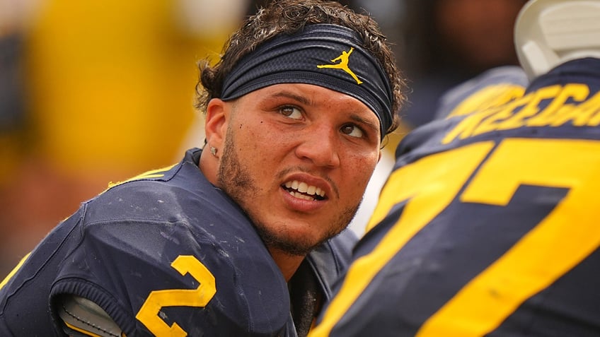 michigans blake corum making an impact off the field realizes bigger purpose than football