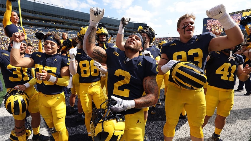 michigans blake corum making an impact off the field realizes bigger purpose than football