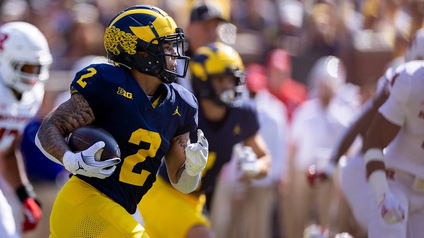 michigans blake corum making an impact off the field realizes bigger purpose than football