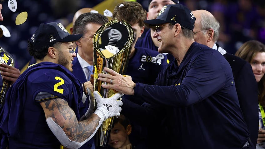 corum and Harbaugh celebrating