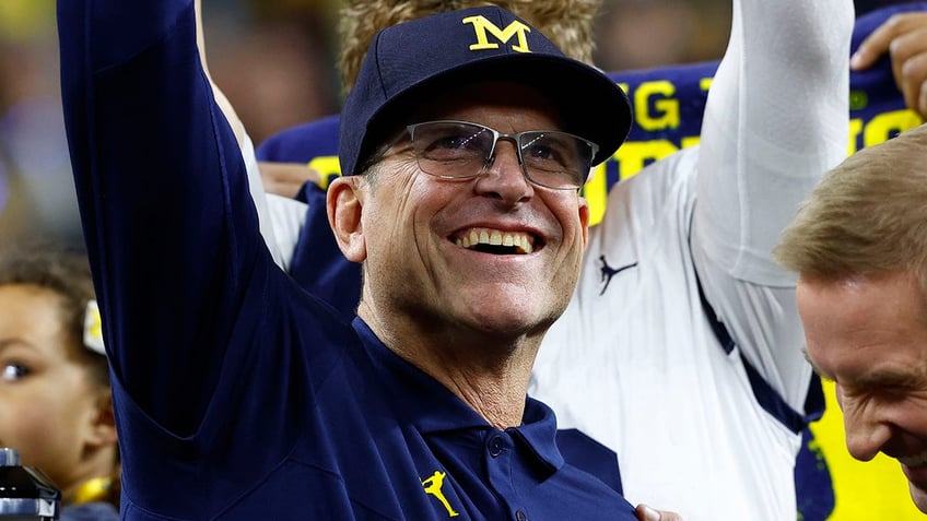 Jim Harbaugh smiles