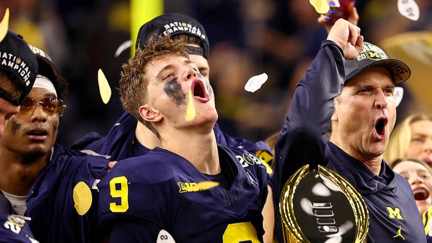 JJ McCarthy with trophy