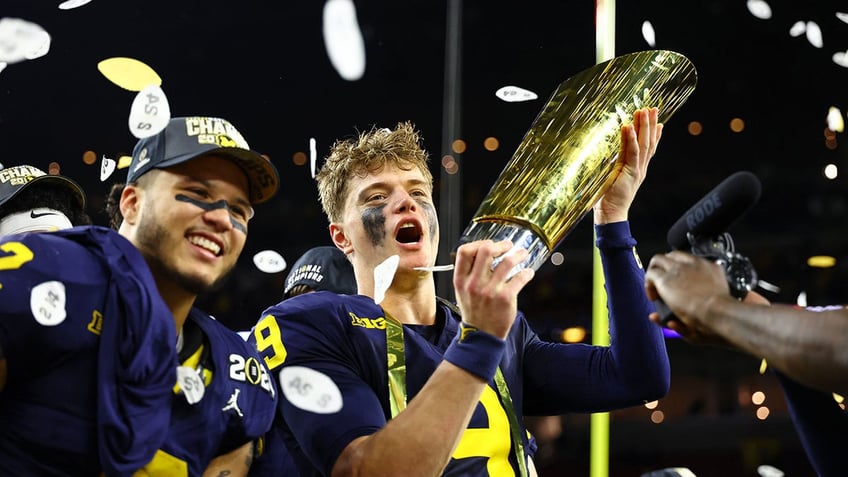 JJ McCarthy with the trophy