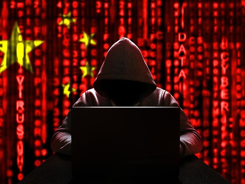 Cyber threat from china. Chinese hacker at the computer, on a background of binary code, the colors of the Chinese flag. DDoS attack