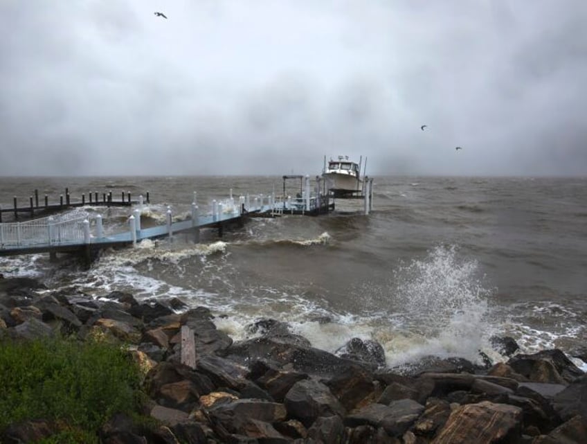 mid atlantic coast under flood warnings as ophelia weakens to post tropical low and moves north