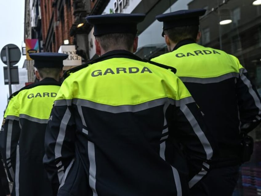 DUBLIN, IRELAND - MAY 18: Three members of the Garda Siochana (Irish Police) are patrollin