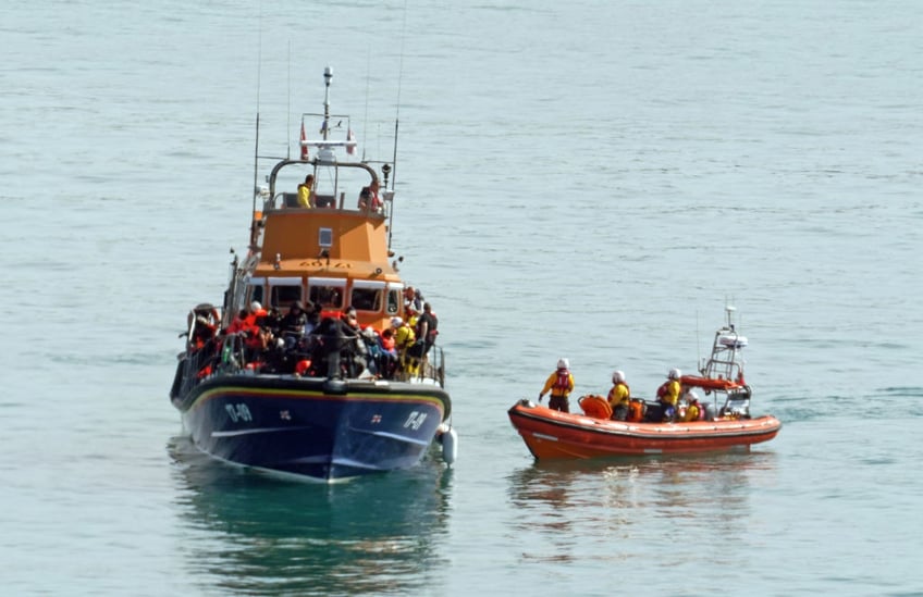 migrant stabbed while trying to break into britain on english channel small boat