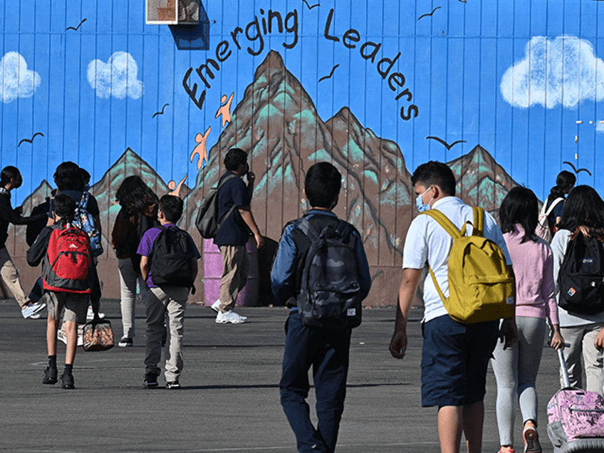 Students walk to their classrooms at a public middle school in Los Angeles, California, Se