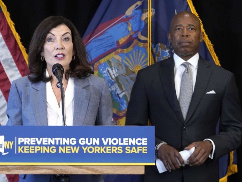 NYPD - New York Governor Kathy Hochul speaks, joined by New York City Mayor Eric Adams (R) and the newly appointed ATF Director Steve Dettelbah, as she delivers remarks about their joint effort to combat gun violence at the High Intensity Drug Trafficking Areas (HIDTA) office on August 24, 2022, in New York City. They outlined steps needed to stem gun violence in the city, citing that the problem is a nationwide issue. The plan is to work with neighboring states with lax gun laws to stem the interstate gun trafficking while employing the latest technological resources. (John Lamparski/Getty Images)