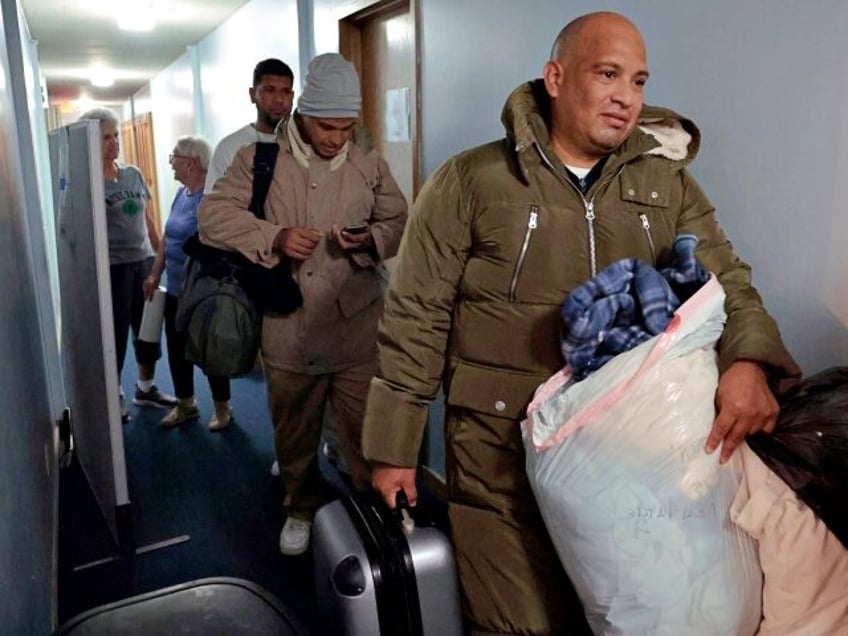 Venezuelan migrants leave with donated clothing at St. Catherine of Siena-St. Lucy Catholi