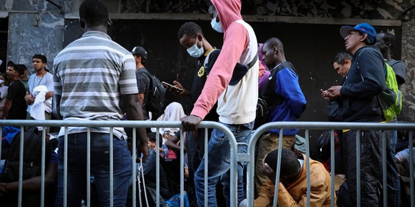 migrants tout nice pool hot food at new york city park converted to shelter report