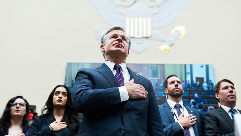 FBI Director Christopher Wray recites the Pledge of Allegiance during the House Judiciary Committee hearing titled "Oversight of the Federal Bureau of Investigation,"