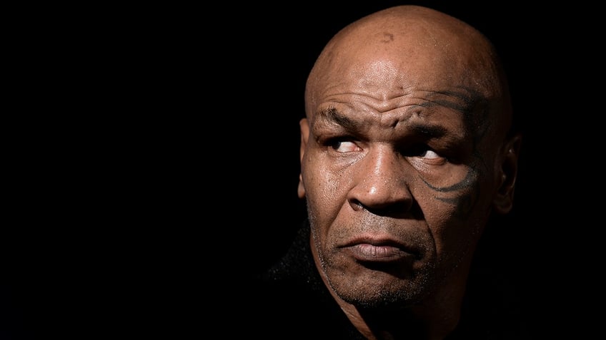 Mike Tyson looks on