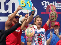 Miki Sudo prevails at annual hot dog eating contest, sets women's record