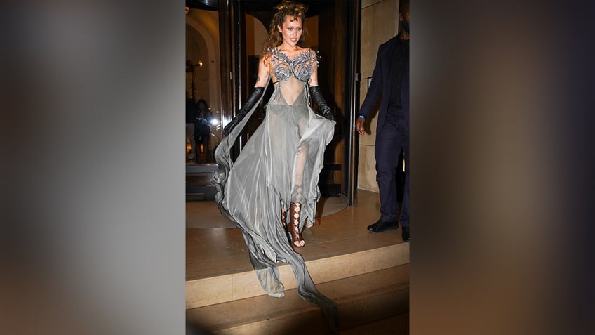 Miley Cyrus in Paris, France in a sheer dress