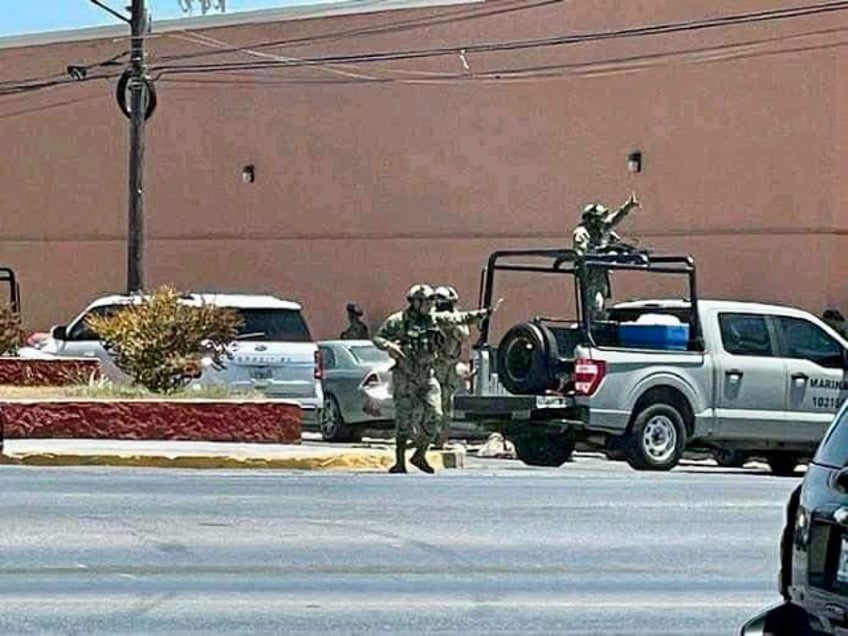 military forces in mexico engage in shootouts raids in border city amid hunt for cartel boss