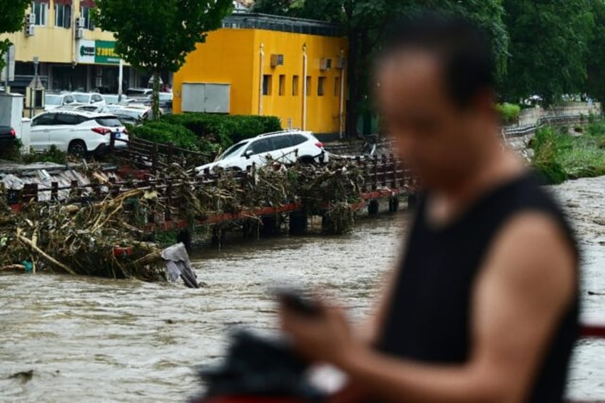 military helicopters deliver aid to beijing flood victims