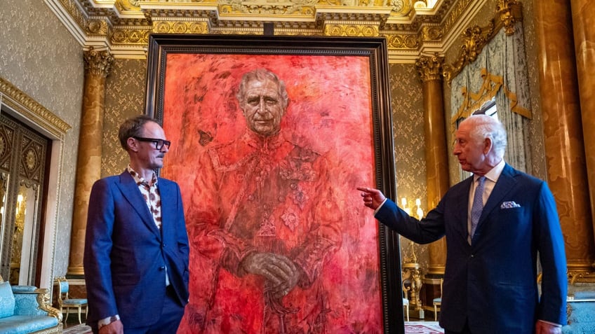 King Charles unveiling his first official portrait