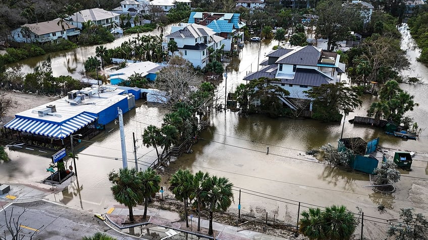 A drone image shows a flooded street due to Hurricane Milton in Siesta Key