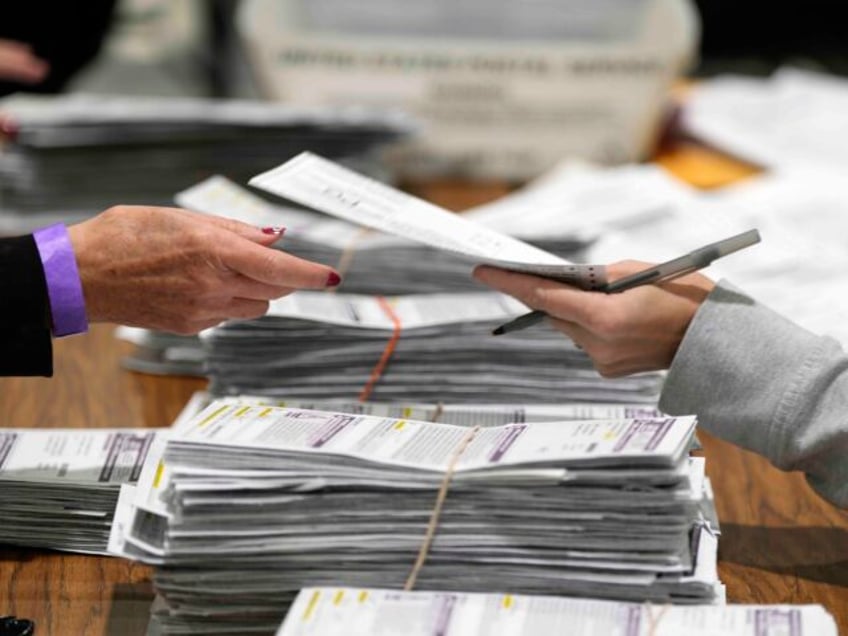 Election workers process ballots for the 2024 General Election, Tuesday, Nov. 5, 2024, in