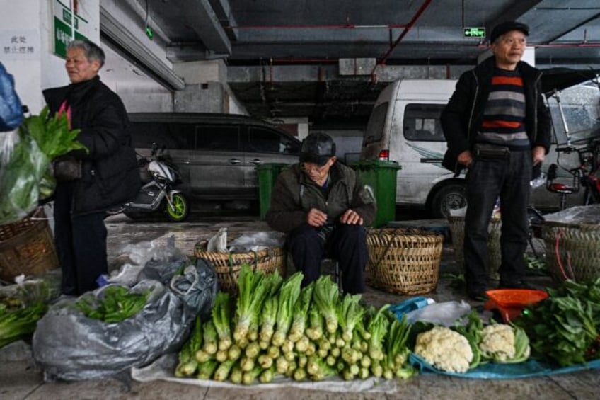 The image of farmers hauling their wares past Chongqing's skyscrapers is a reminder that m