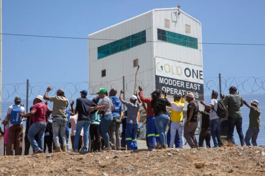 miners from a rival union are holding hundreds of colleagues underground in south africa police say