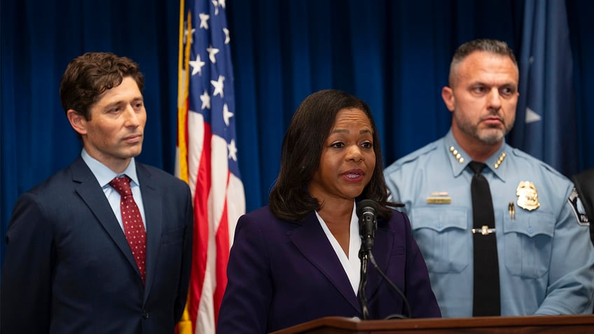 Assistant Attorney General Kristen Clarke of the Justice Department's Civil Rights Division speaks at a news conference