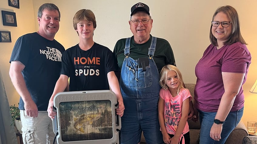 minnesota boy reels in wallet filled with 2000 cash while fishing and returns it to iowa farmer