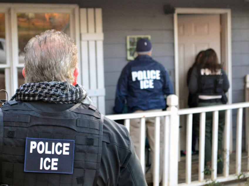 In this Feb. 9, 2017, photo provided U.S. Immigration and Customs Enforcement, ICE agents