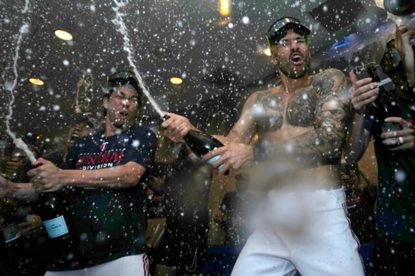 minnesota twins clinch al central title with 8 6 win over angels