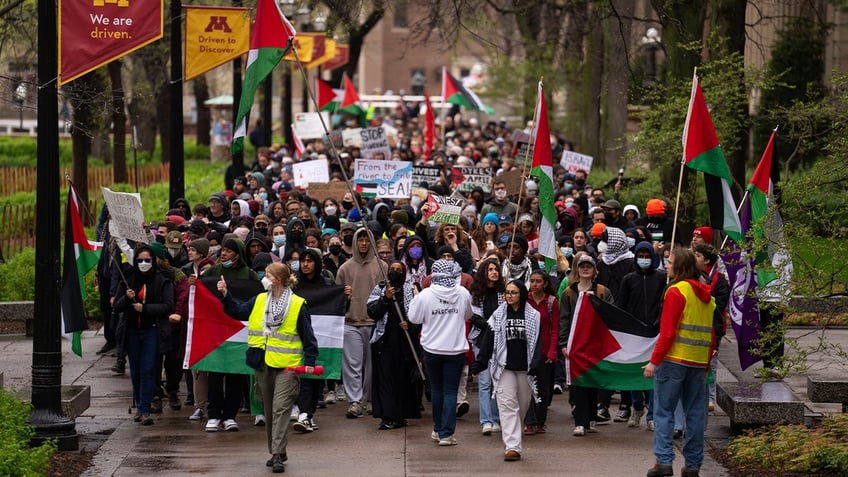 A few hundred people gathered outside Coffman Memorial Union to call for a cease-fire in Gaza before marching on the Northrop Mall and setting up an encampment on the lawn Monday afternoon, April 29, 2024, on the University of Minnesota campus in Minneapolis.