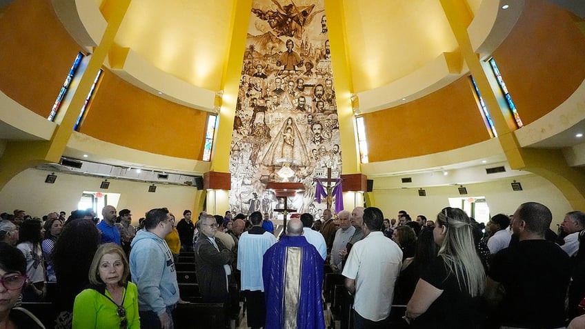 priest in purple celebrating Mass