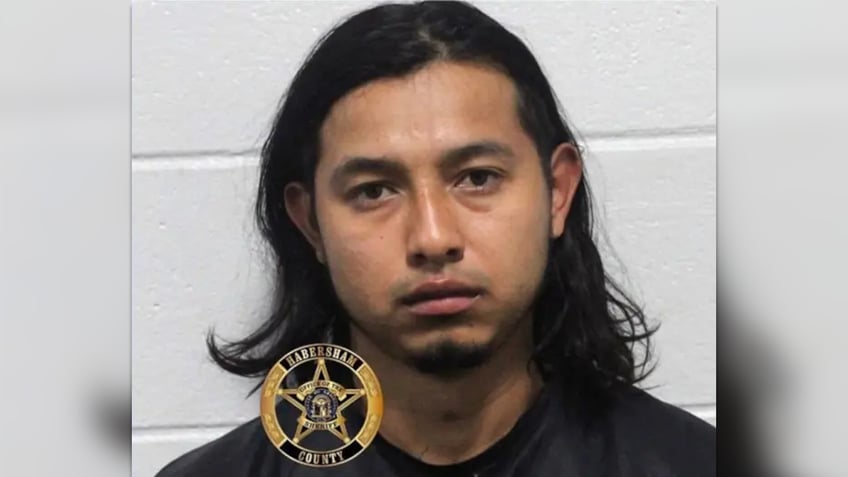 angel dejesus rivera-sanches mugshot has shoulder-length black hair in a mugshot