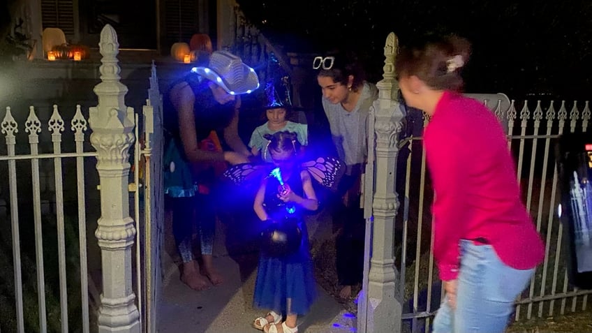 missing halloween for heart surgery neighbors throw early trick or treat surprise for 4 year old girl