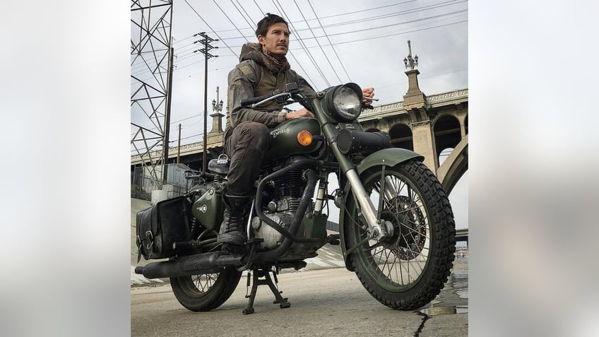 Justin Alexander Shetler sitting on a motorcycle