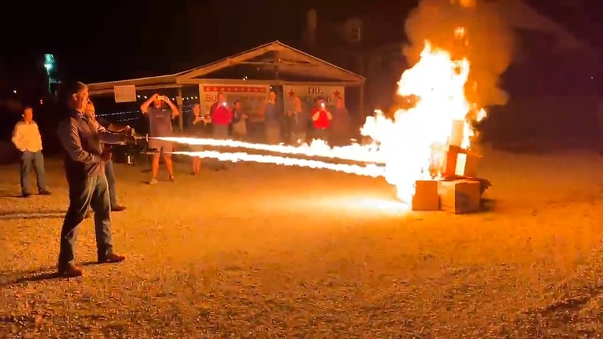 Missouri state senators blowing flames on empty boxes