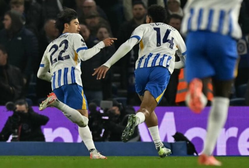 On target: Brighton's Kaoru Mitoma (L) celebrates scoring the opening goal