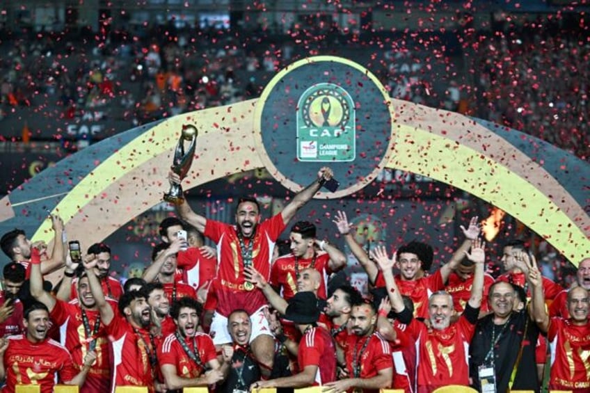 Al Ahly of Egypt players celebrate in Cairo after defeating Esperance of Tunisia in the 20